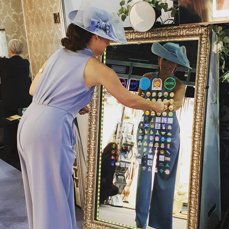 Woman using Just A-Pose selfie mirror emojis
