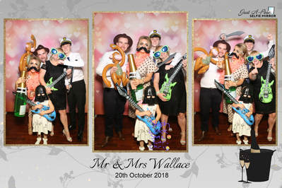family at wedding reception using photo booth